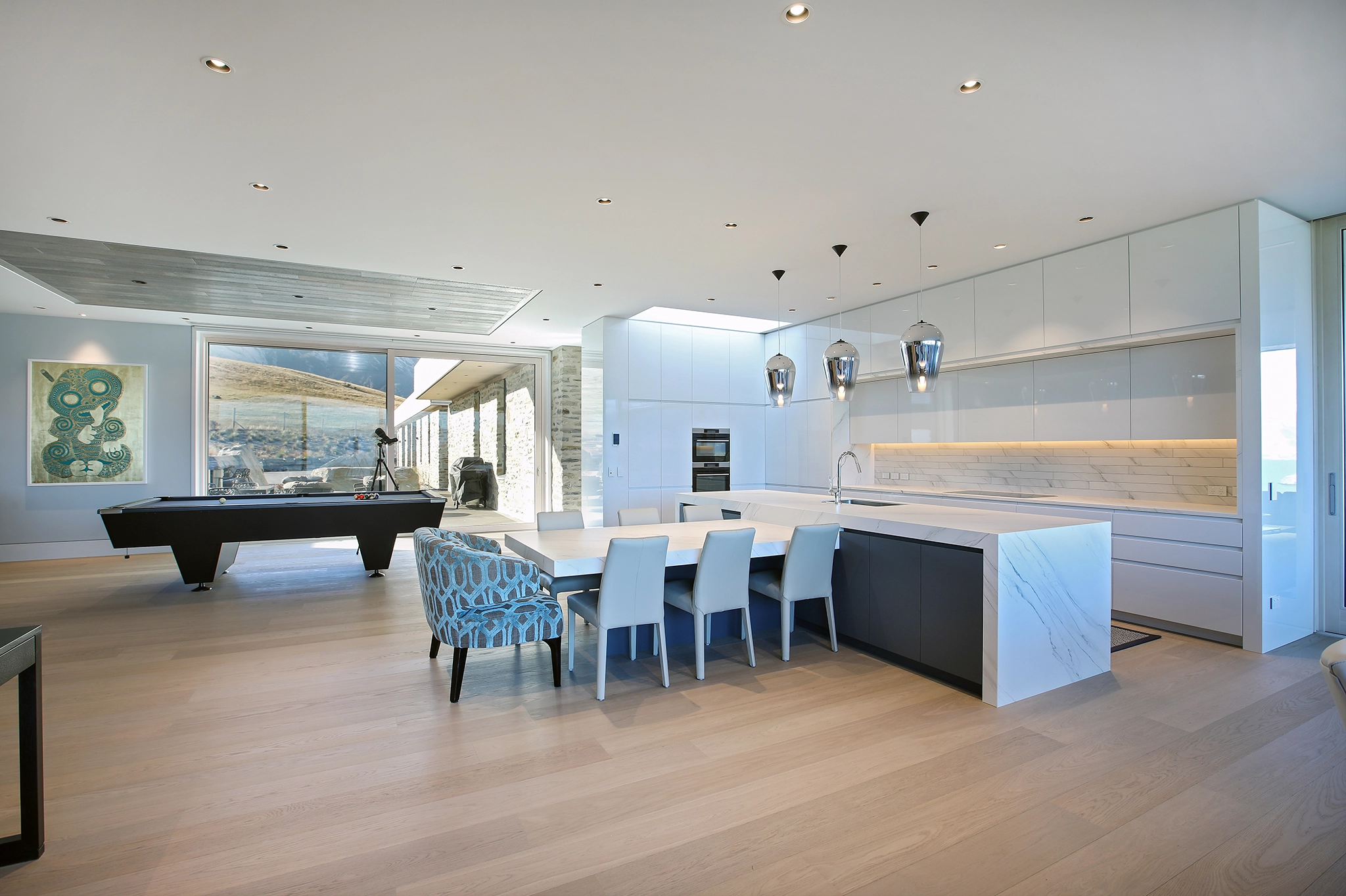 Clean whites contrasting warm custom timber interior finishes at Te Toka, Jacks Point, Queenstown