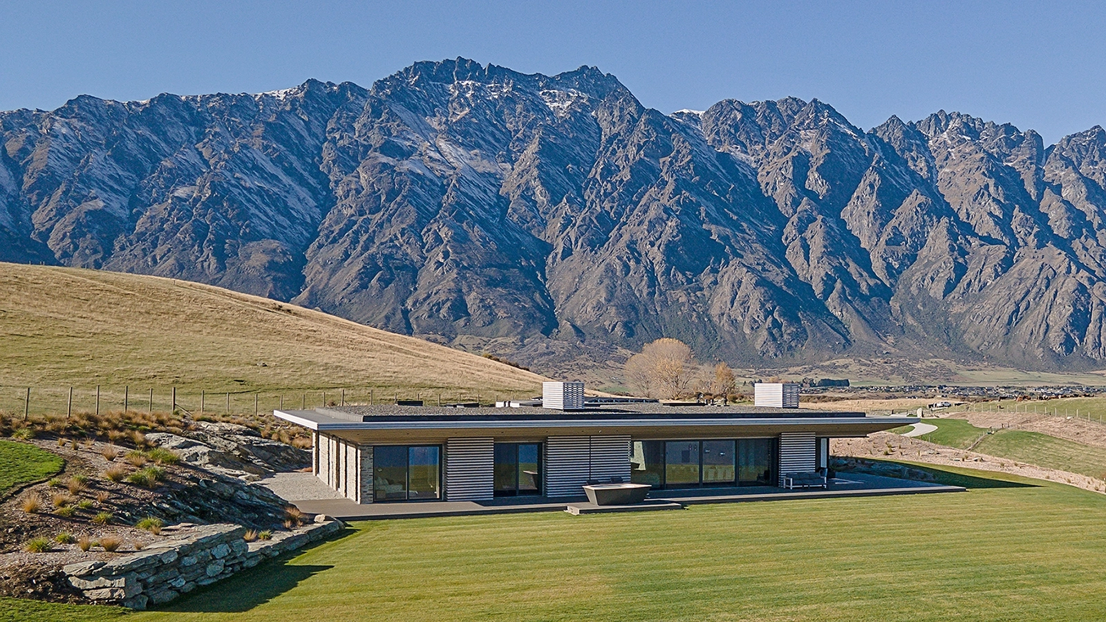 Wide-plank custom timber interior finishes unifying indoor and outdoor spaces, Te Toka Queenstown
