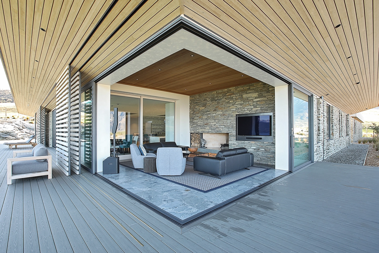 Custom timber interior finishes in a lounge with direct lake sanctuary views, Te Toka Queenstown