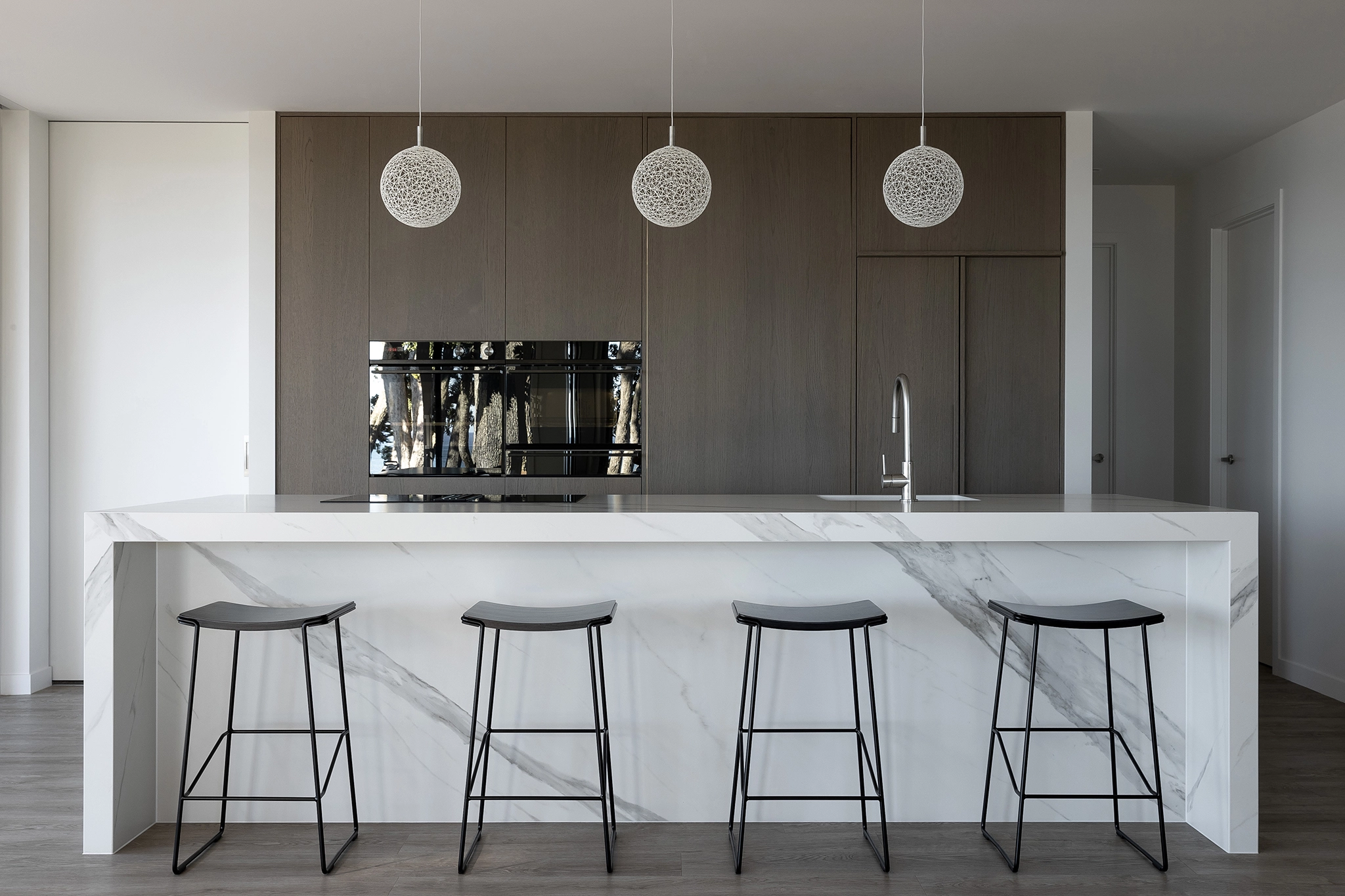 Prefinished timber veneer NZ in a contemporary coastal NZ home kitchen, Oakura, Taranaki