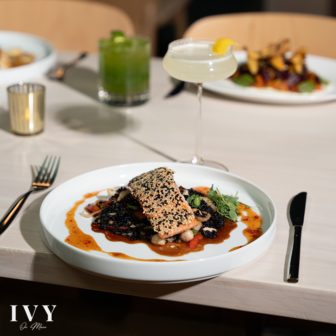 Social media content showing an excavator clearing large branches during a residential construction project.