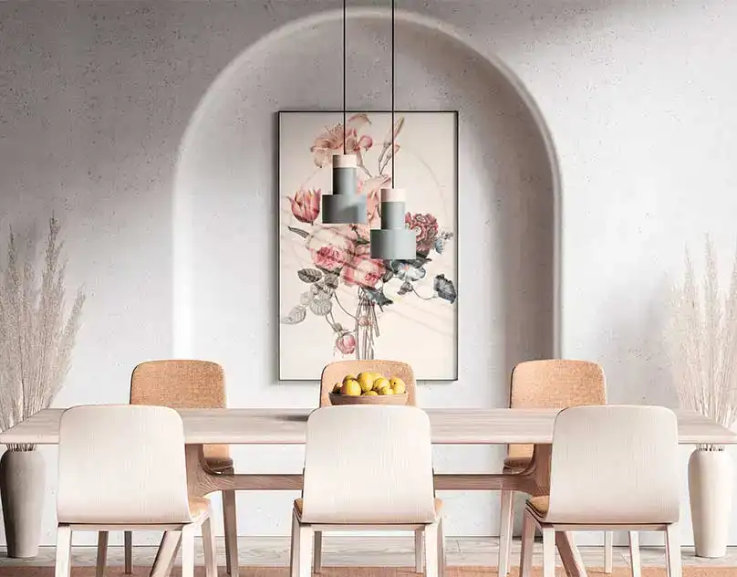 Modern dining room with a floral painting and pendant lights in a concrete arch setting.