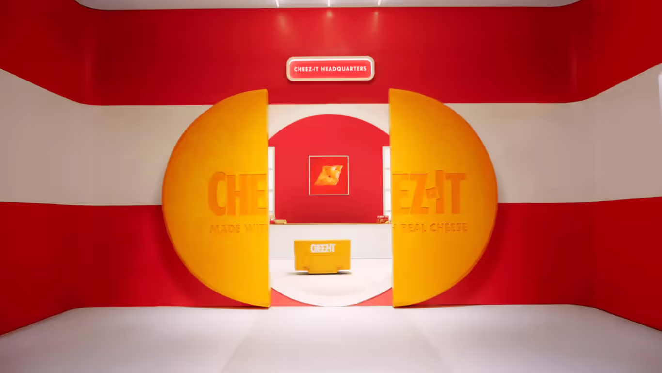 Bold yellow Cheez-It doors opening to reveal a whimsical red-and-yellow branded office interior.