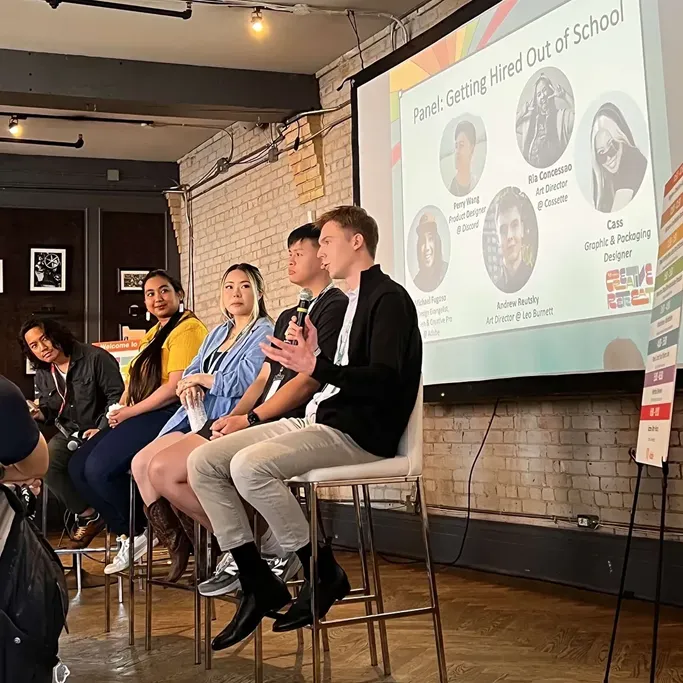 Andrew Reutsky speaking on the 'Getting Hired Out of School' panel at the Adobe Creative Retreat in Toronto, alongside fellow panelists.
