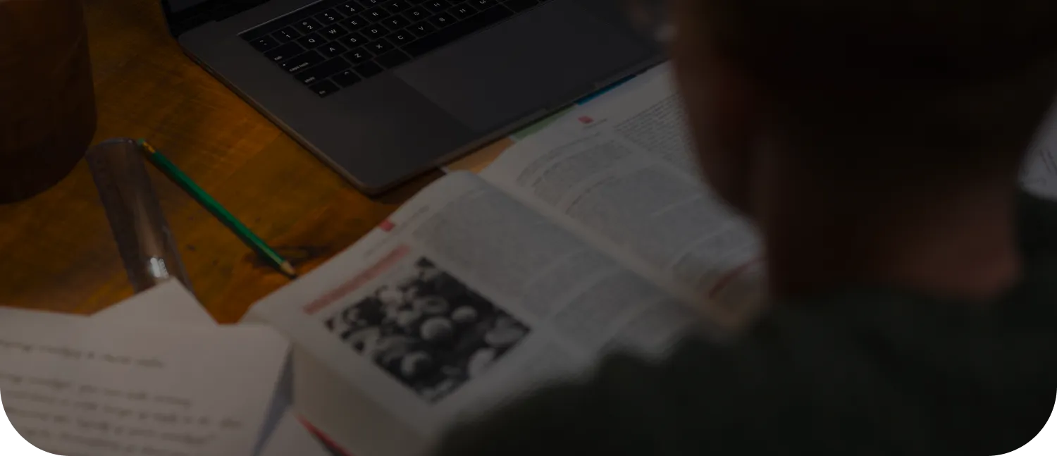 Background image of a student watching a webinar.