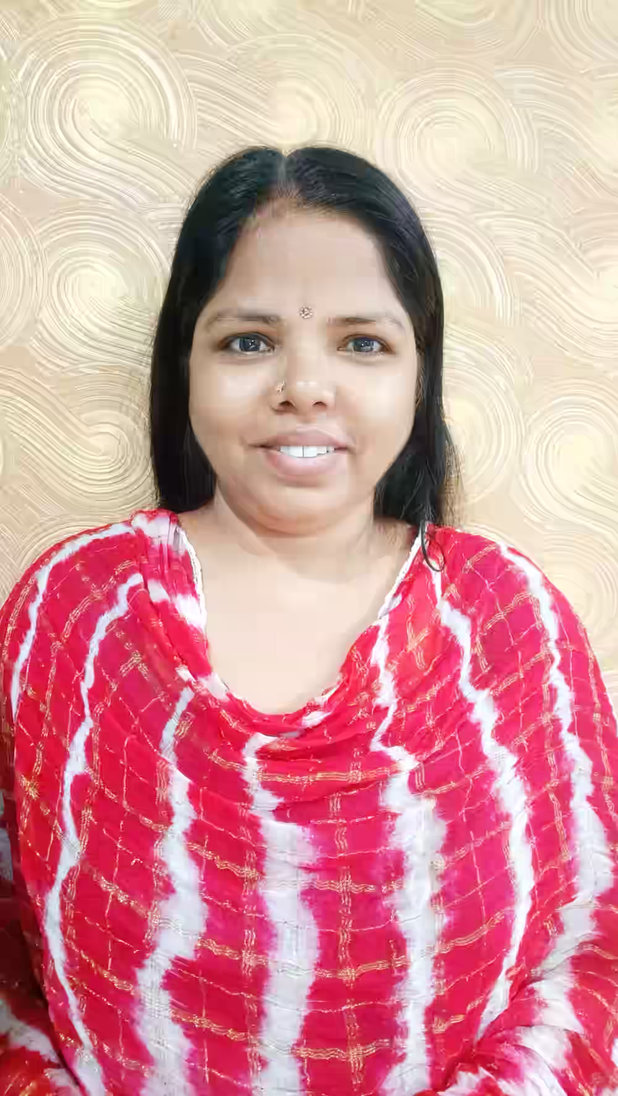 Smiling woman in red and white tie-dye style patterned top