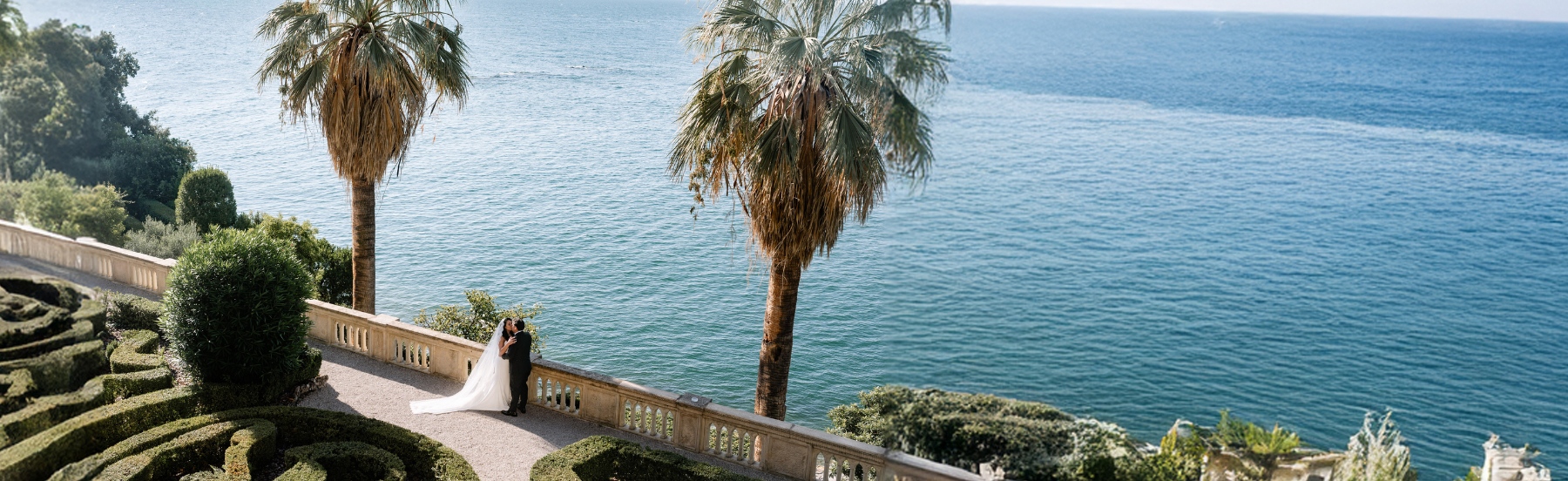 bride and groom driving in a classic mercedes