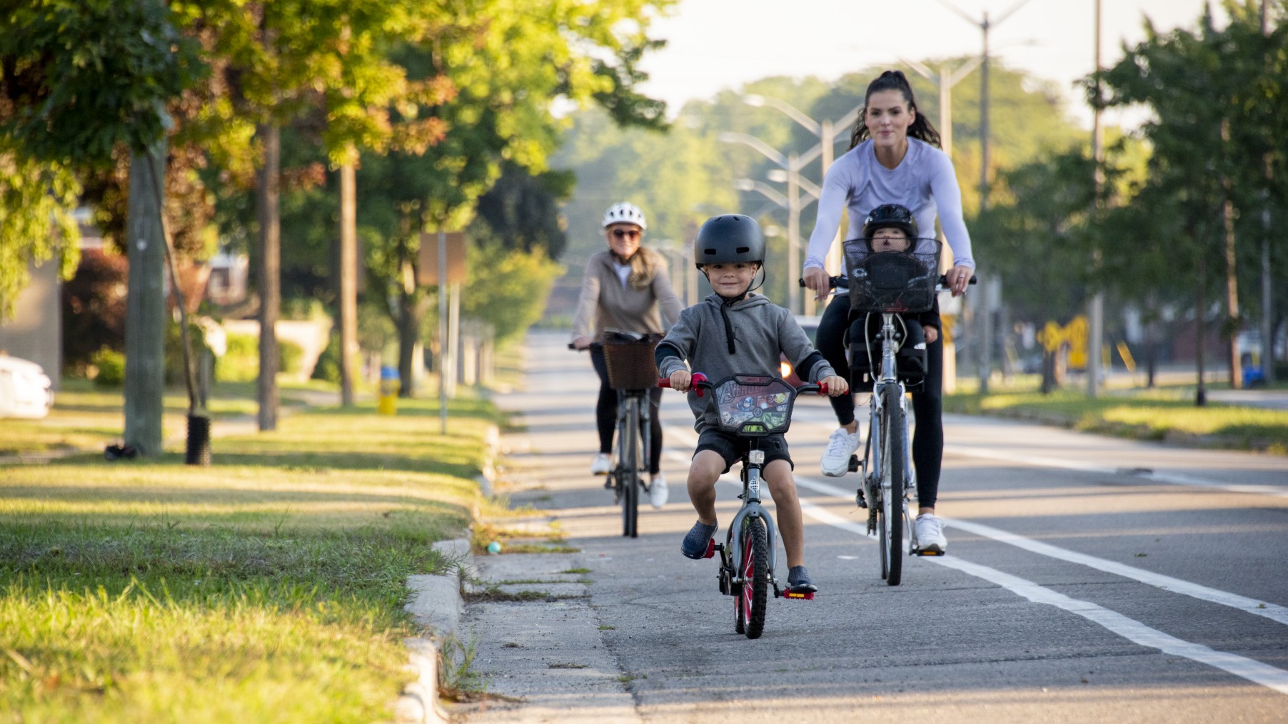 Family cycling along Indian Road North
