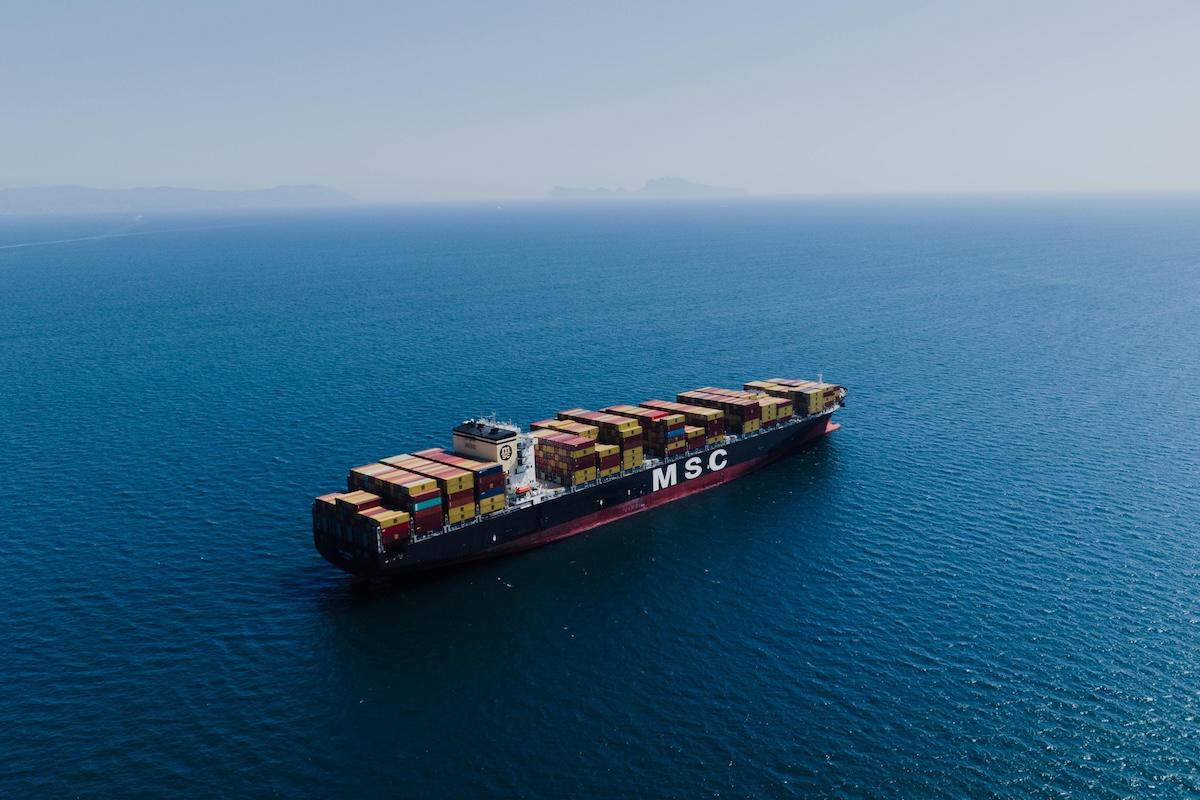 Fully Loaded Cargo Ship Sailing on Sea