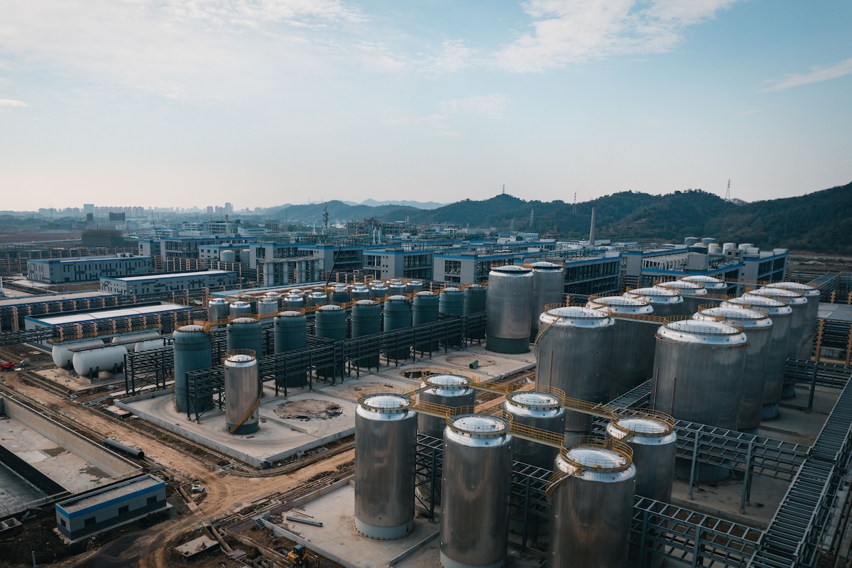 Expansive aerial view of an industrial complex with storage tanks, located in China.