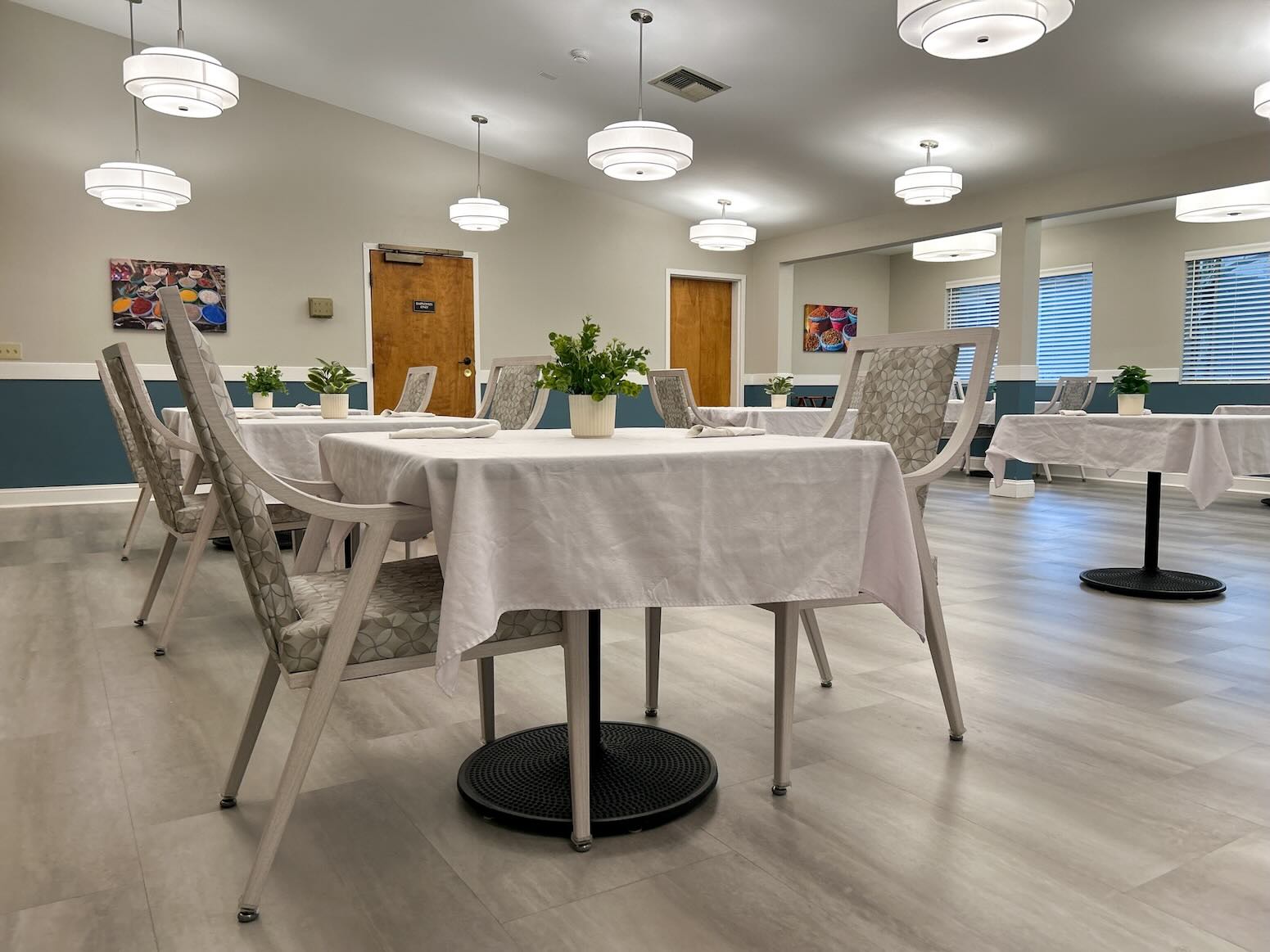 River's Bend Main Dining Room showing tables with white tablecloths.