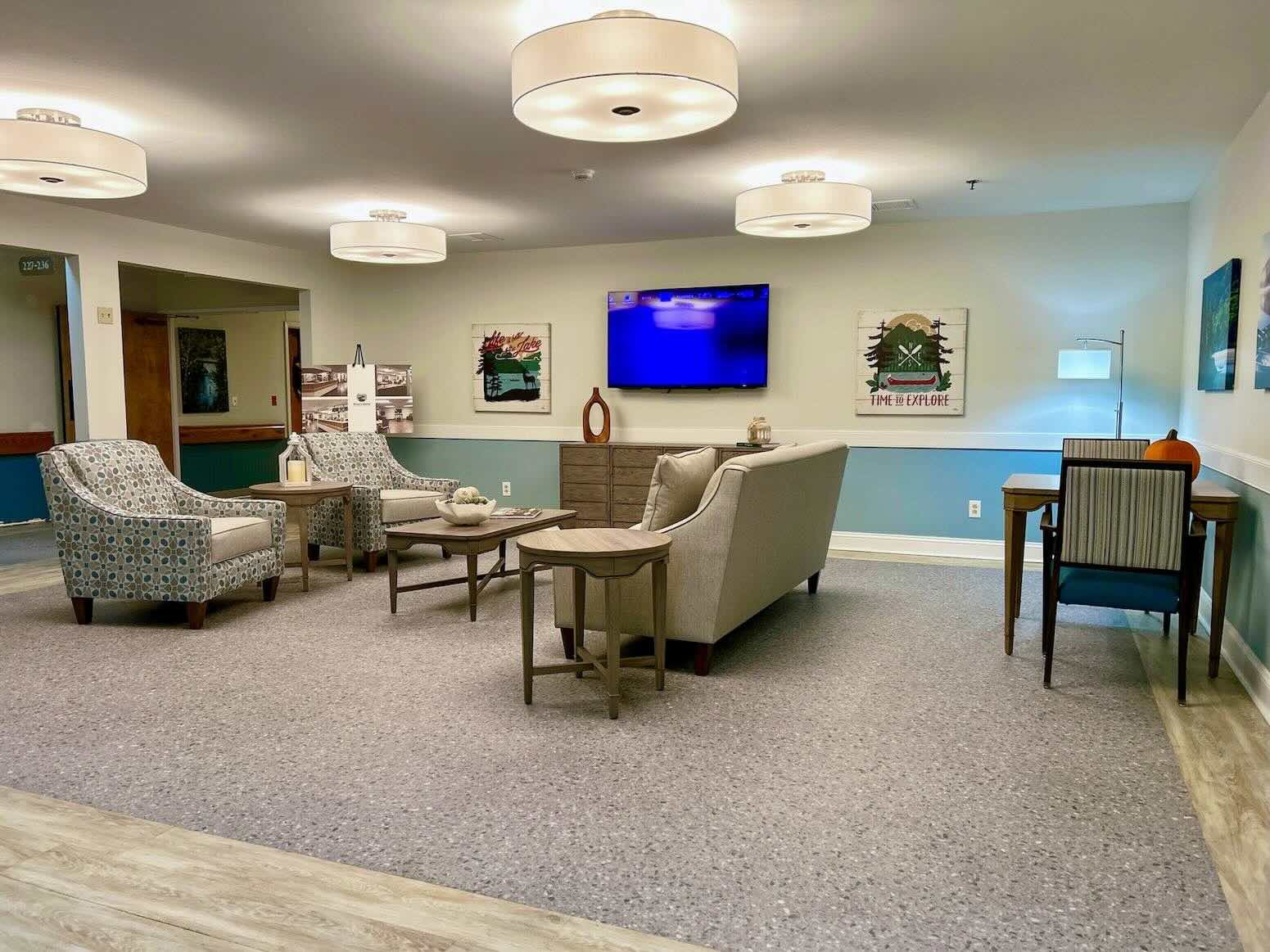 River's Bend lounge with couches and TV.