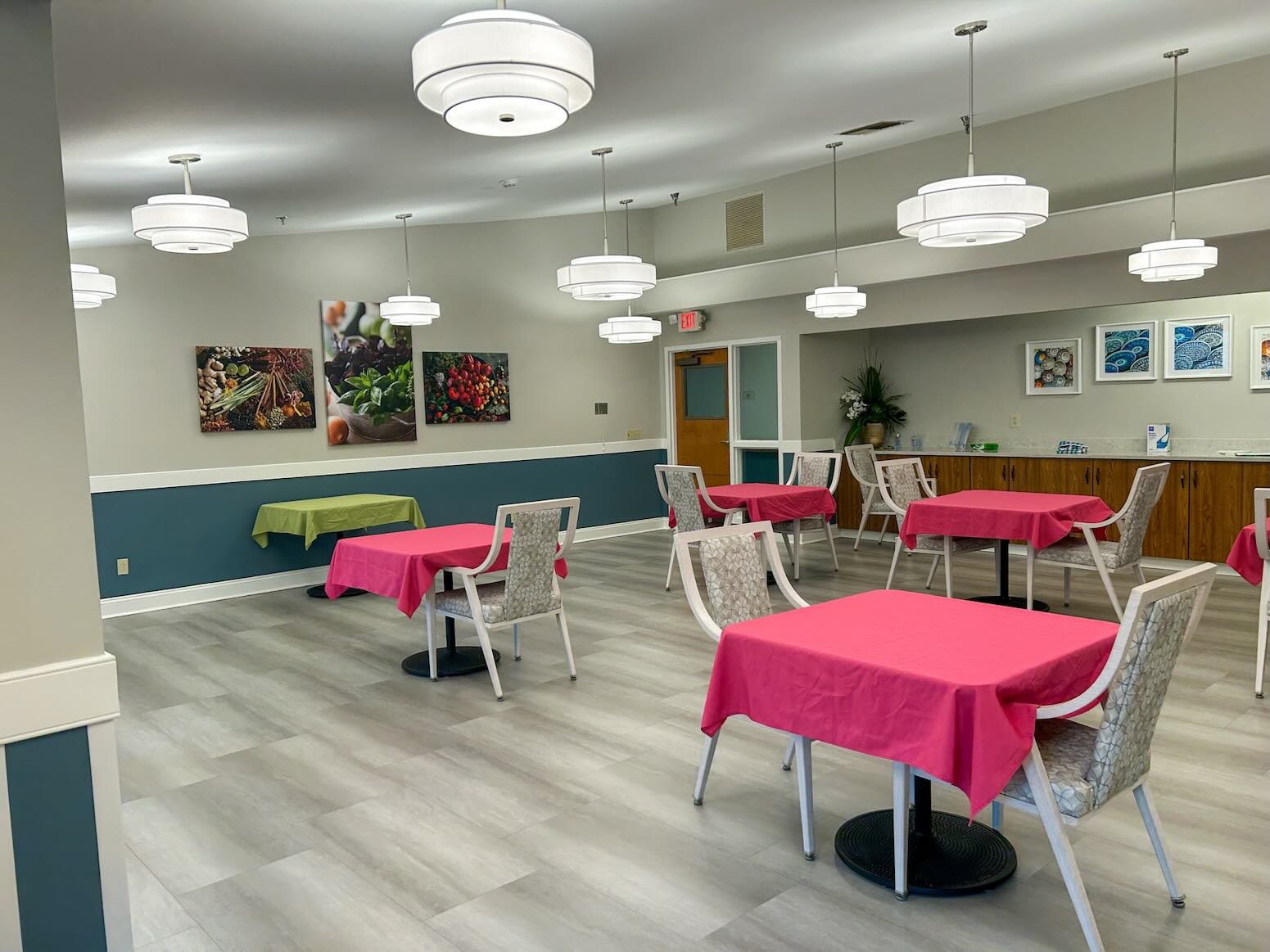 River's Bend Main Dining Room showing tables with red tablecloths.