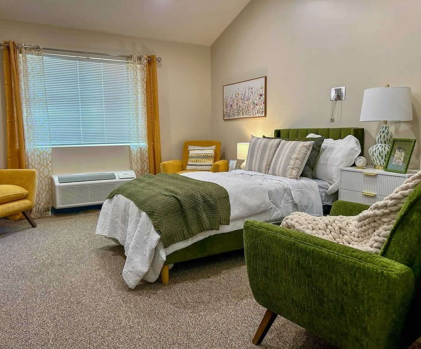 Assisted Living Studio showing bed and chair at River's Bend Assisted Living.