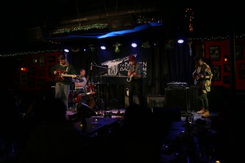 Tiberius on stage at a show in Cambridge MA.