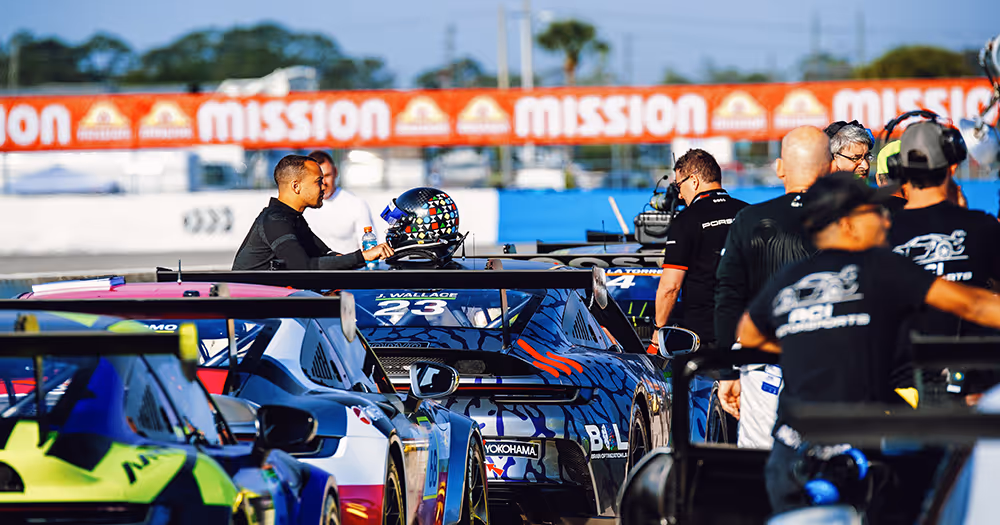 Jordan Wallace with Kellymoss race car for Race Forward initiative