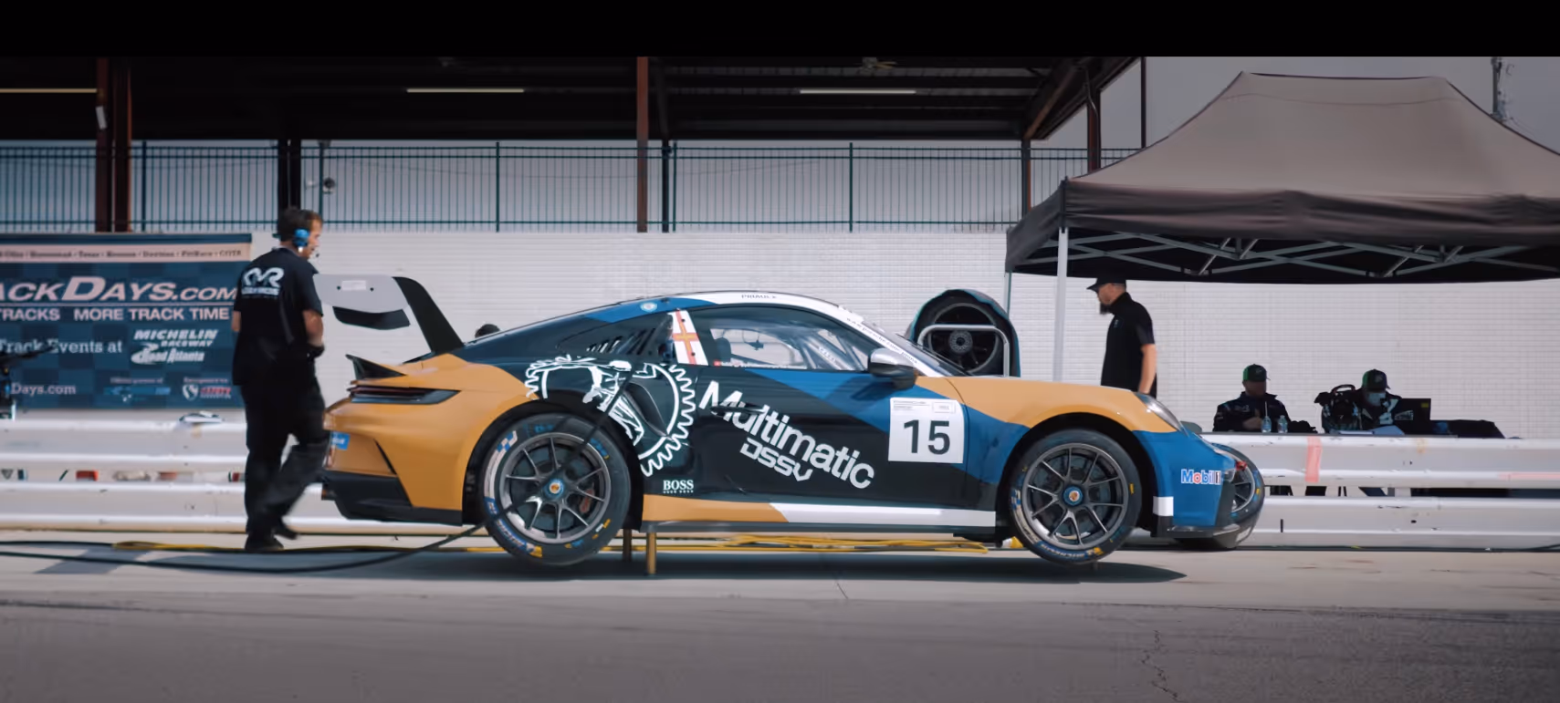 Kellymoss Porsche race car on track showing the excitement and accessibility of motorsports for new audiences.