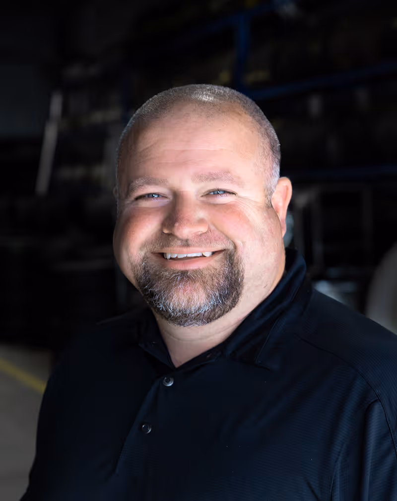 Headshot of Andy Kilcoyne smiling