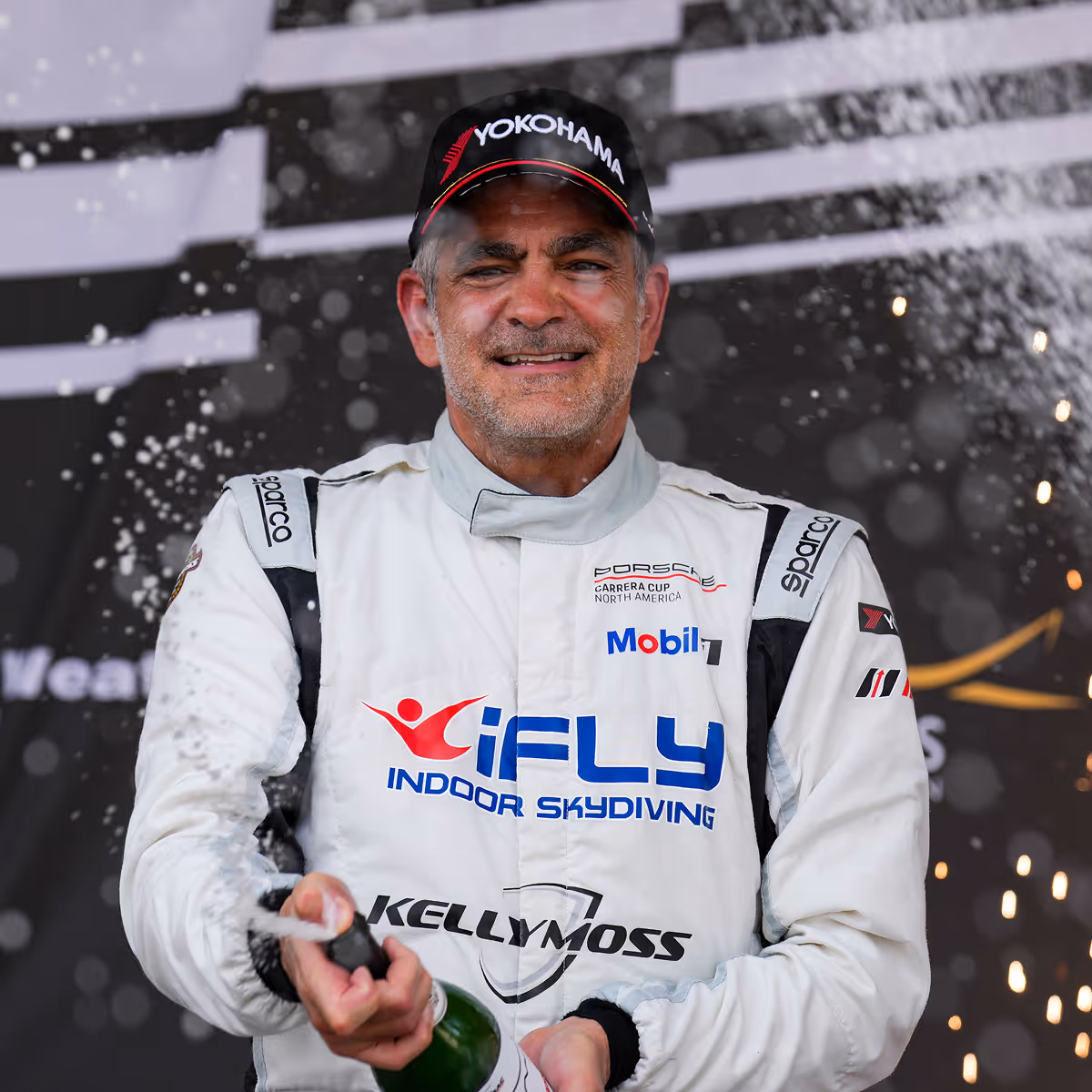 Kellymoss team pro race car driver Alan Metni celebrates a win