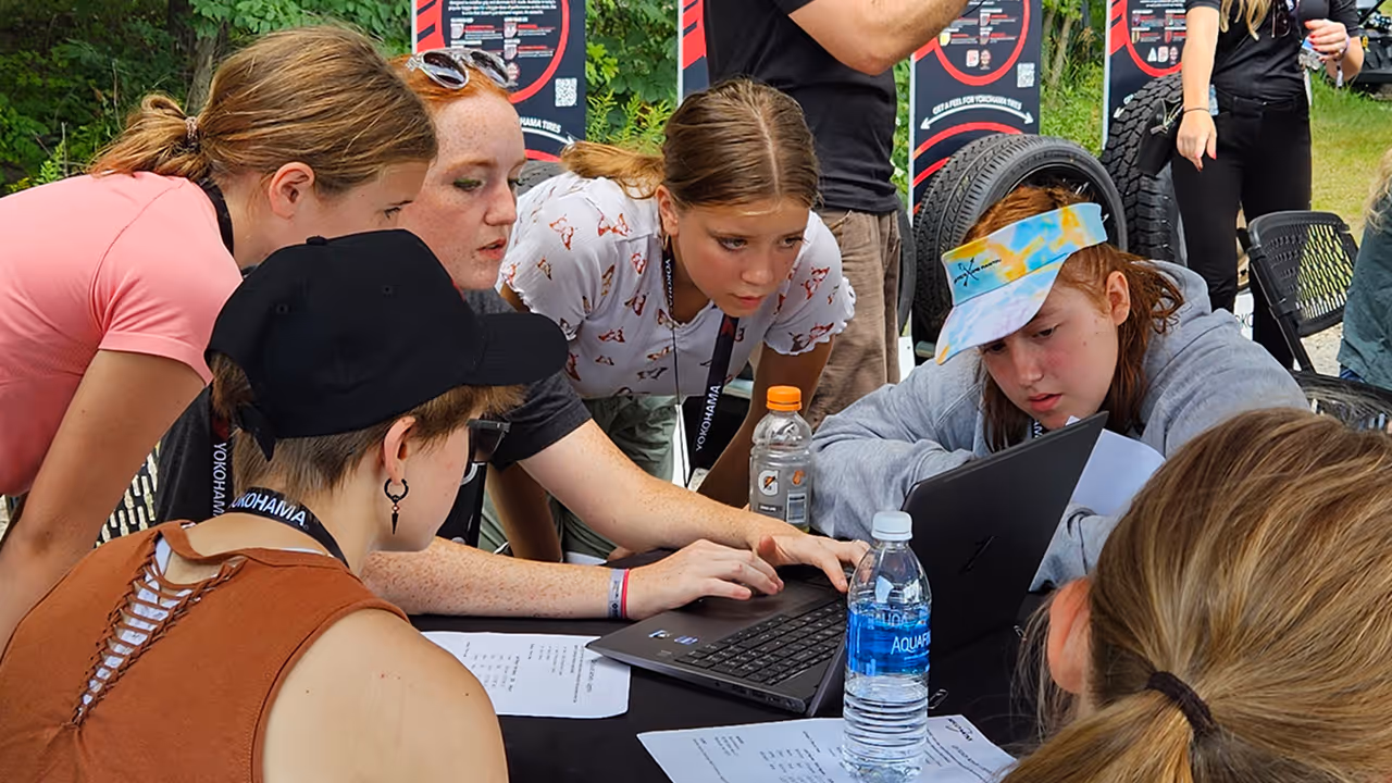 Students taking part in interactive motorsports learning activities with the Kellymoss race team.