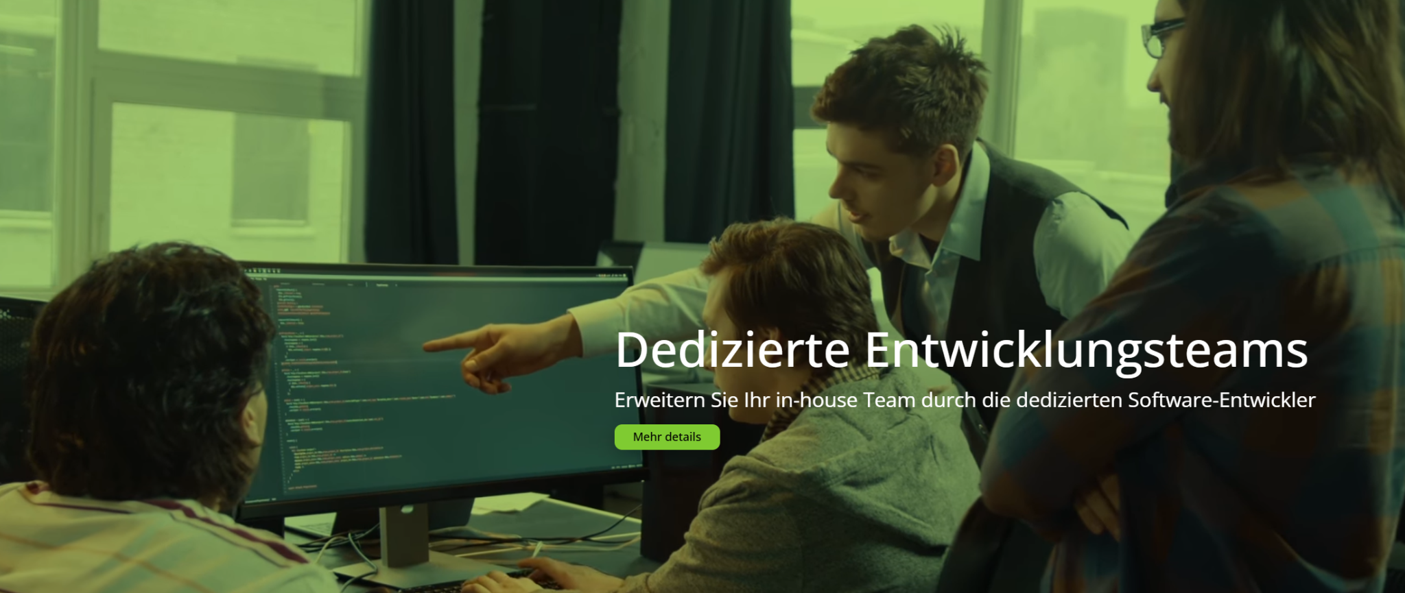 Chudovo software development team collaborating on code, representing their engineering excellence and dedicated team model for IT consultancy.
