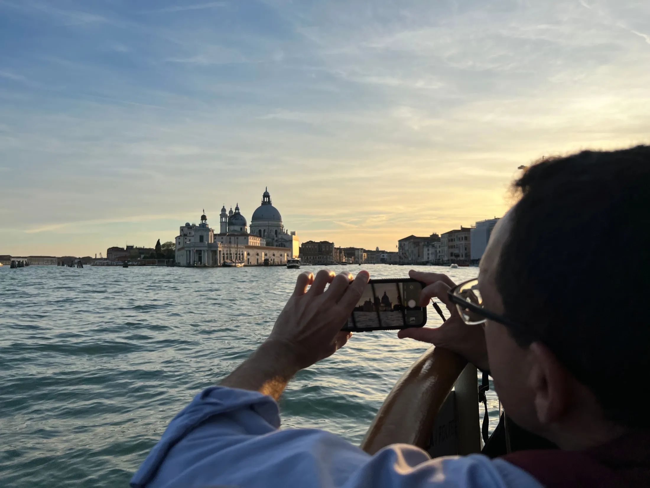 Lyle Goldberg on the Grand Canal in Venice photographs the Church of the Salute (Photo Edward Goldberg, 2025)