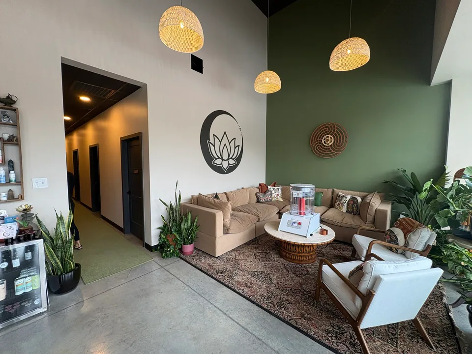 Heal Wellness: Lounge with polished concrete floors and pendant lighting