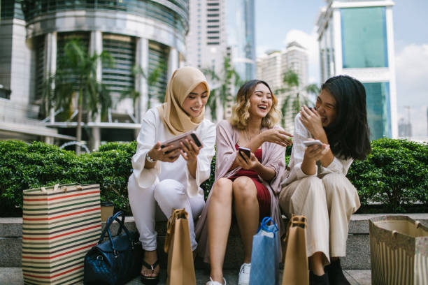 Group of Asian women enjoying each other's company after shopping