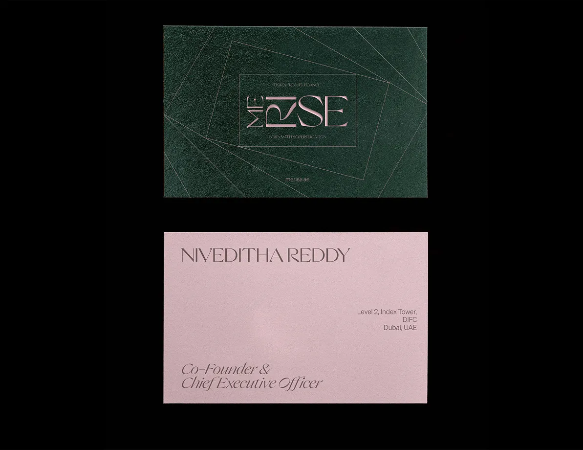 Two business cards with dark green background and pink text logo MERISE and pink card with name Niveditha Reddy, Co-Founder & CEO, with Dubai address.