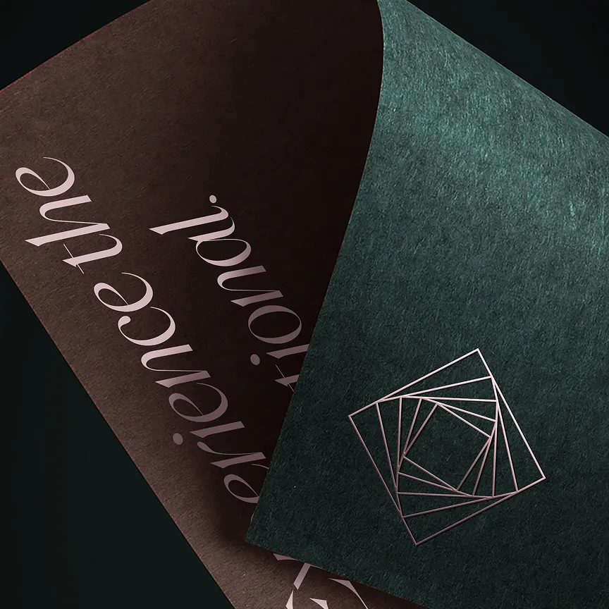 Two textured cards, one dark brown with cursive text 'experience authentic' and one dark green with a geometric square spiral design.