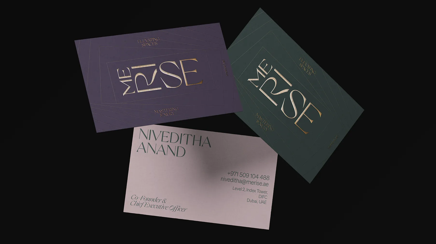 Three business cards on a black background; two cards display the Merise logo with the tagline 'Elevating Spaces, Mastering Luxury,' and one card shows contact details for Niveditha Anand, Co-Founder & CEO, including phone, email, and Dubai office address.