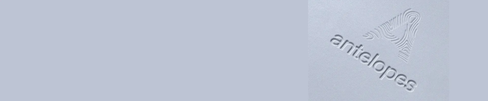 Embossed stylized antelope head logo above the word 'antelopes' on a light textured surface.