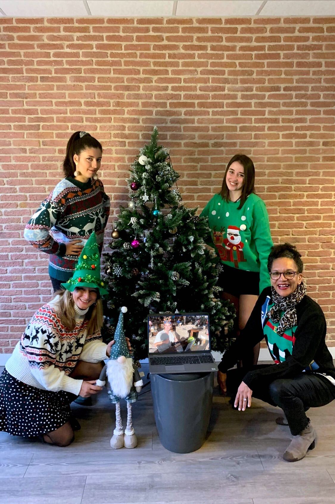 Team Christmas photo, all wearing Christmas jumpers