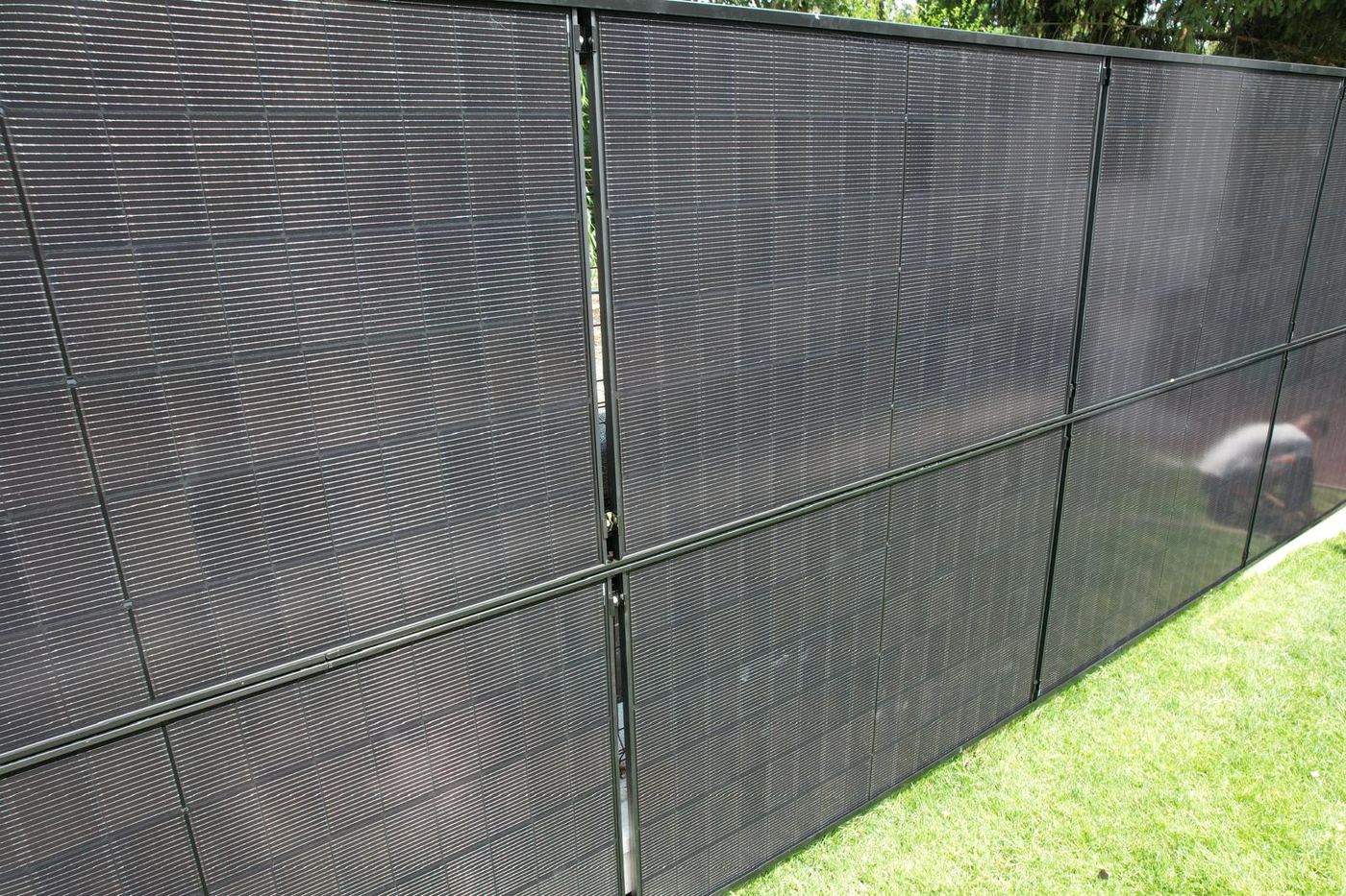Close-up of the solar panels forming the RAULI FENCE mounted on vertical posts