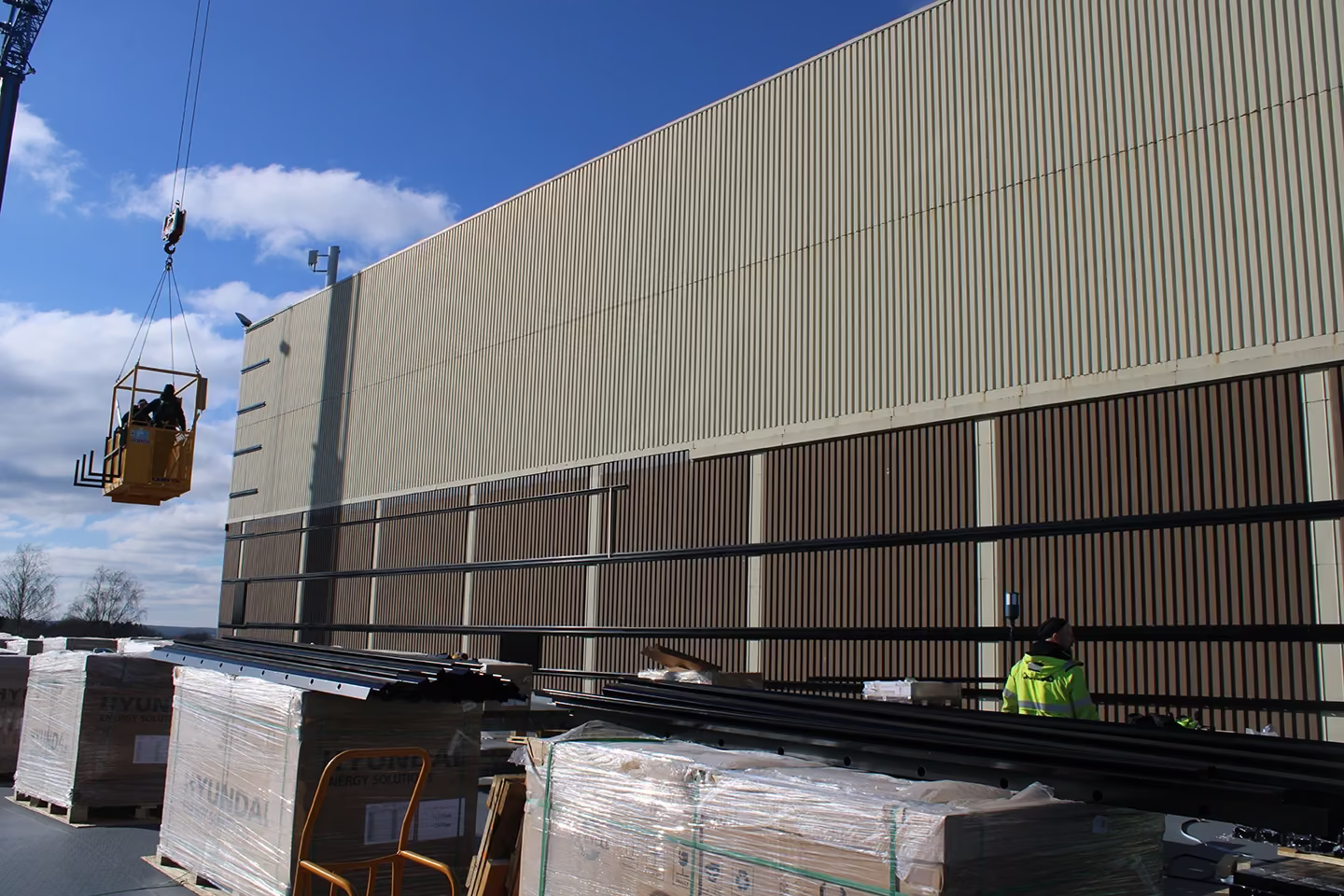 RAULI WALL system installation in Norway, WALL top and bottom rails in place on a huge commercial building.