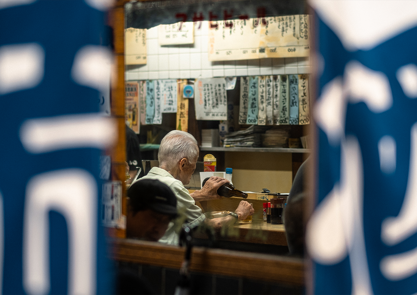 Photo of a woman holding an umbrella and her skirt with the other hand, walking down the street in the pouring rain,