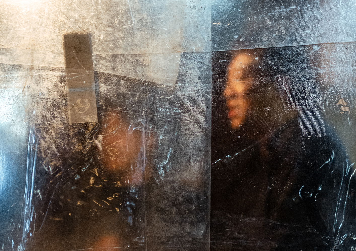 Photo of a woman holding an umbrella and her skirt with the other hand, walking down the street in the pouring rain,