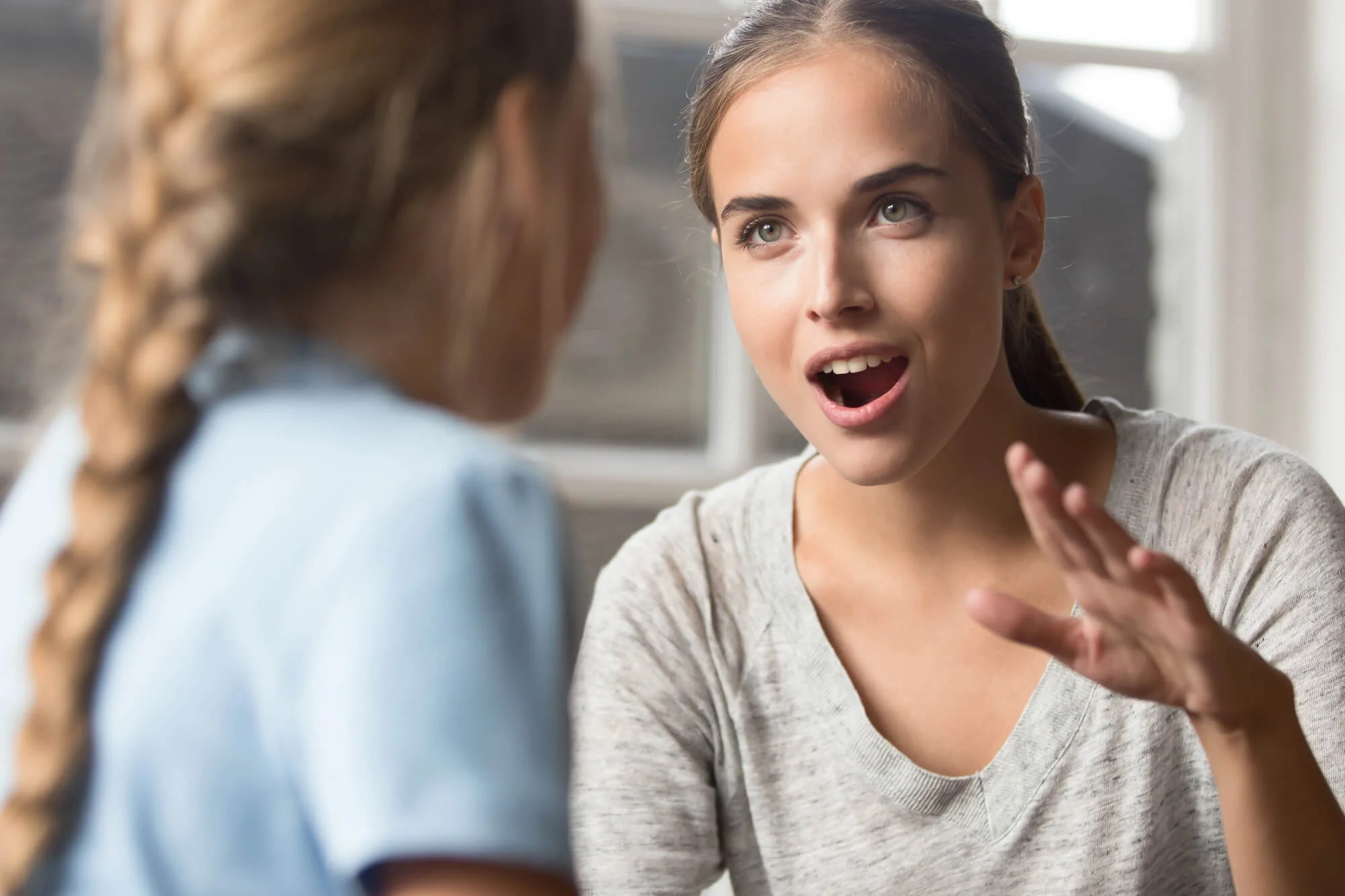 parent talking to her child about the Pediatric Dentist in Wayne