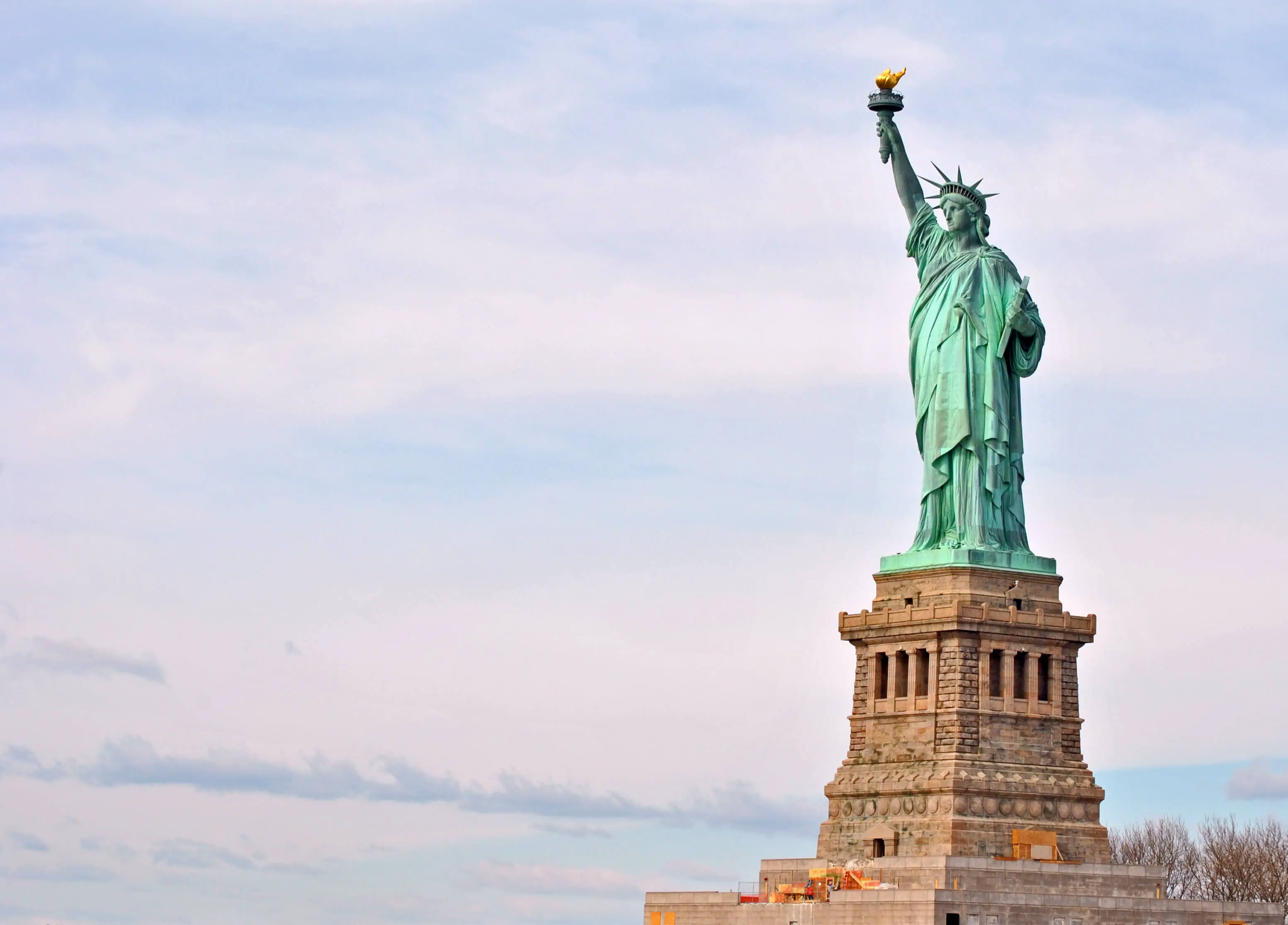 Statue of Liberty viewed from the ferry with New York City skyline in the background