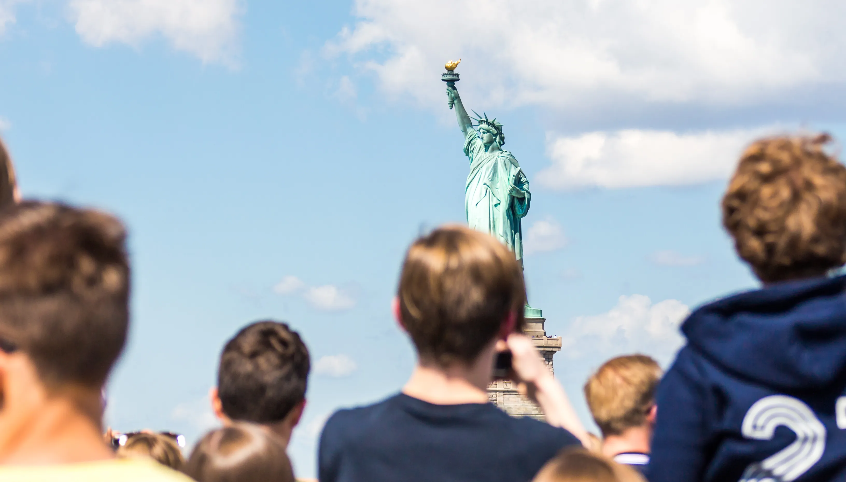 Teenagers visiting Statue of Liberty in New York City