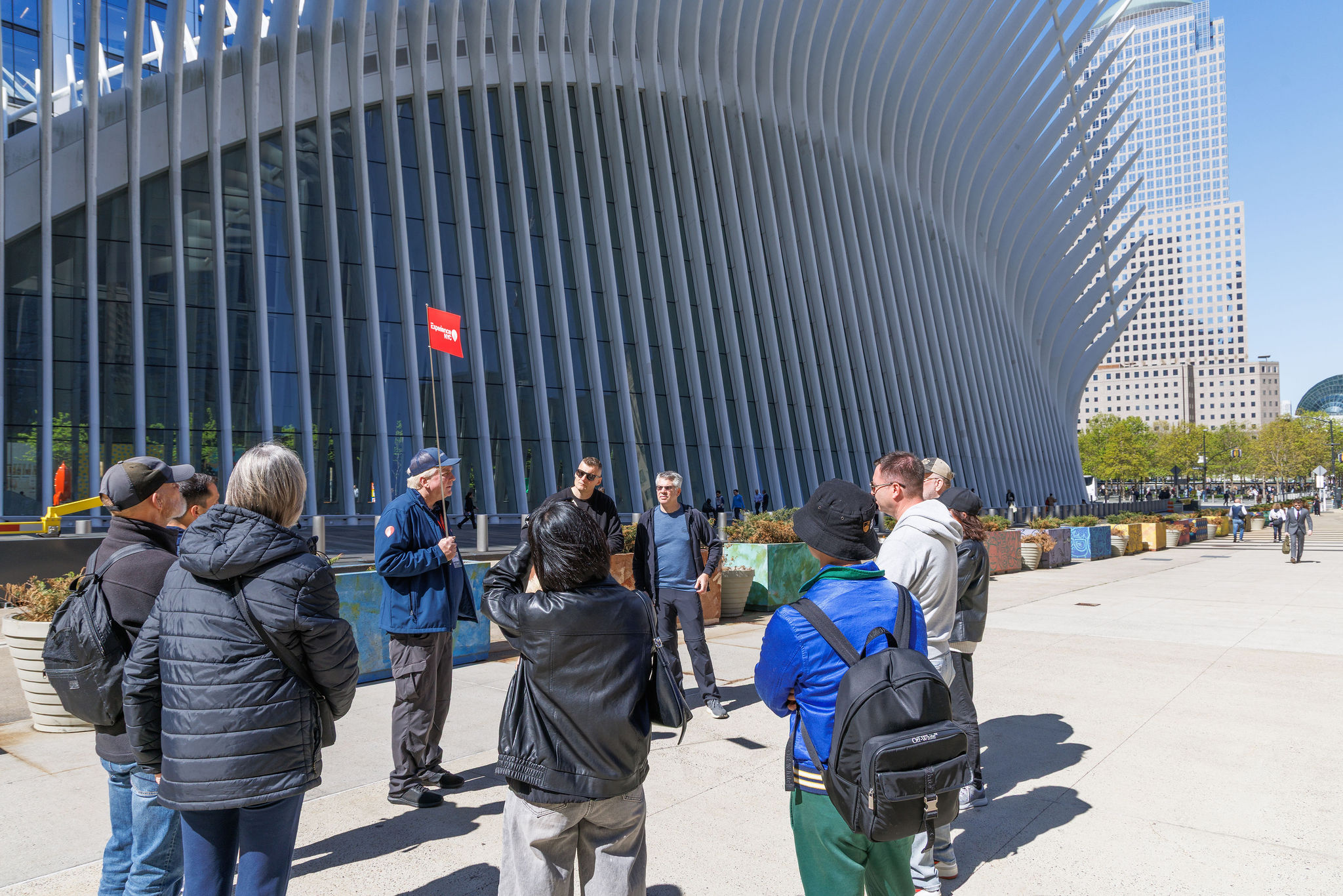 Tour guide conducting a guided tour outside Oculus in NYC