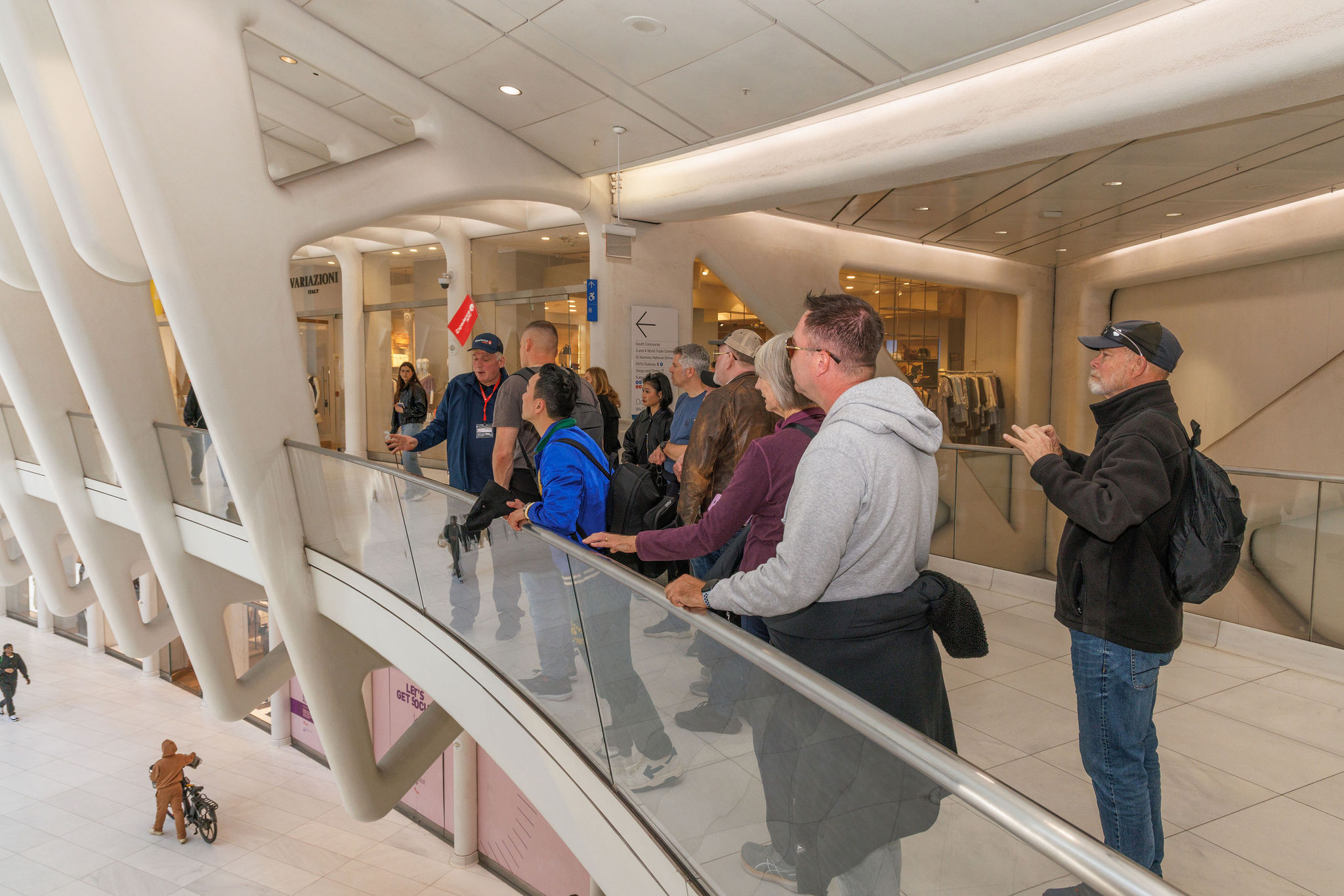 Tour guide conducting a guided tour of Ground Zero inside the Oculus in NYC