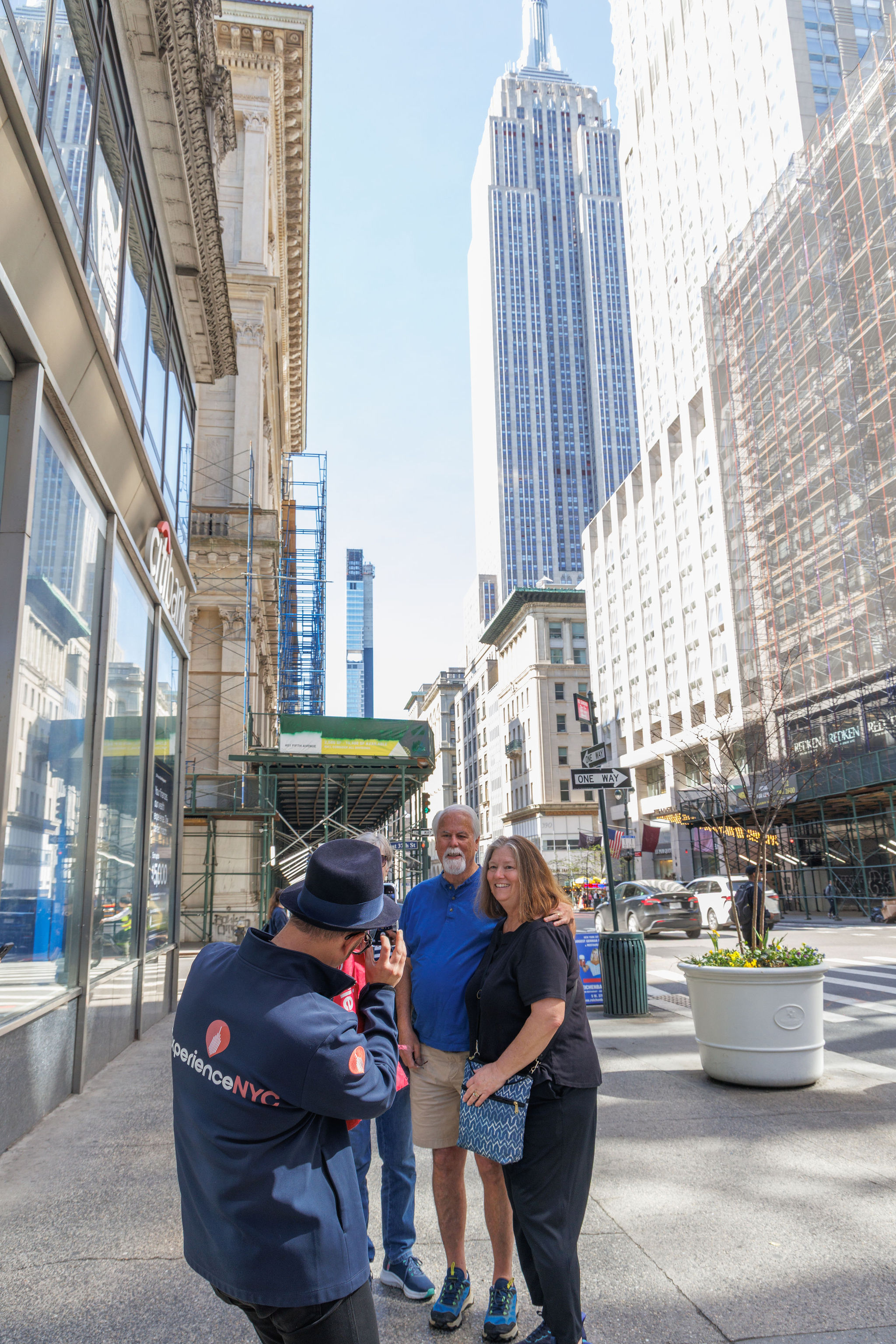 Tour group exploring and taking pictures with Empire State Building