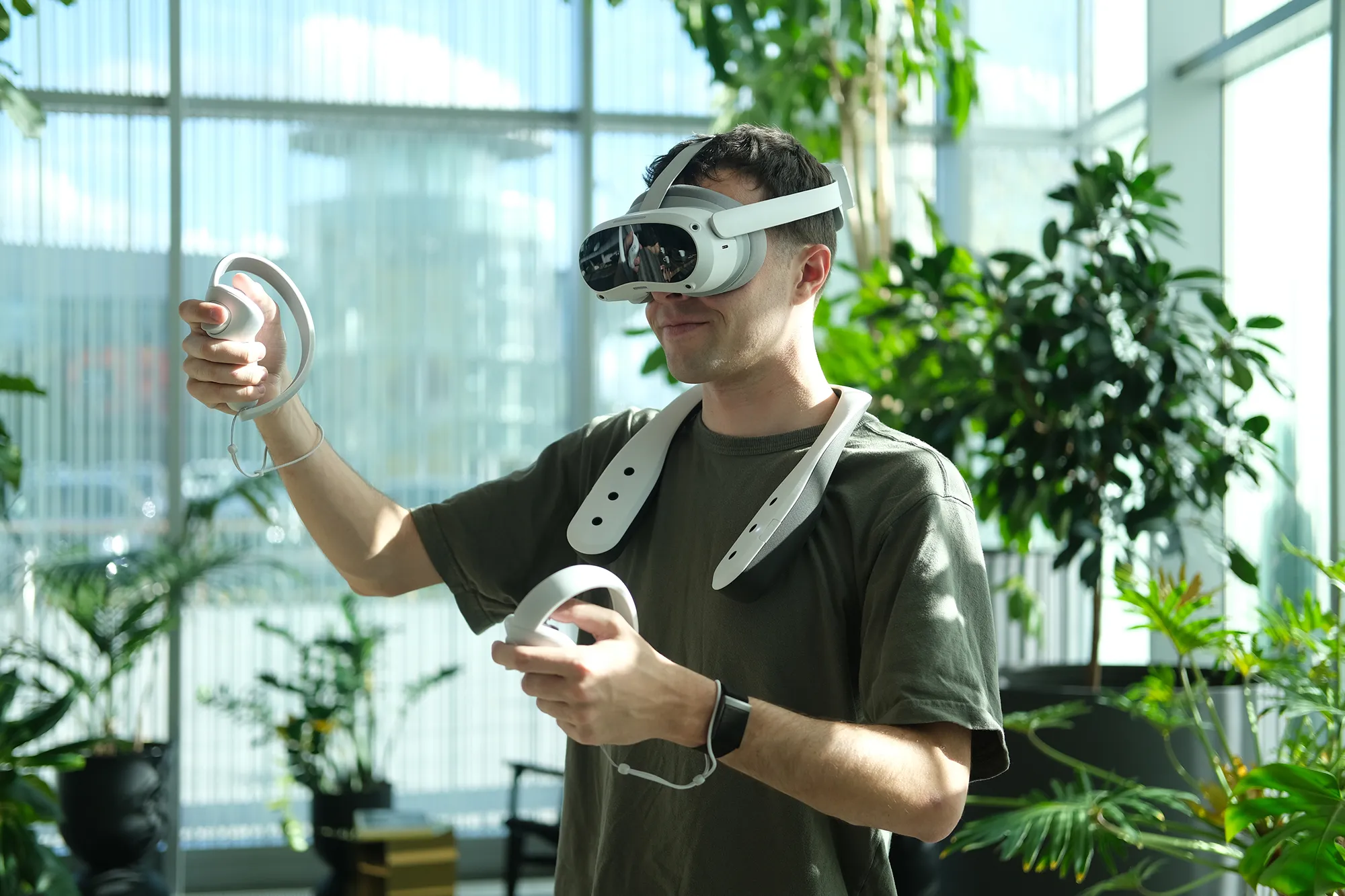A man using the Scentient Escents device in combination with a VR headset.