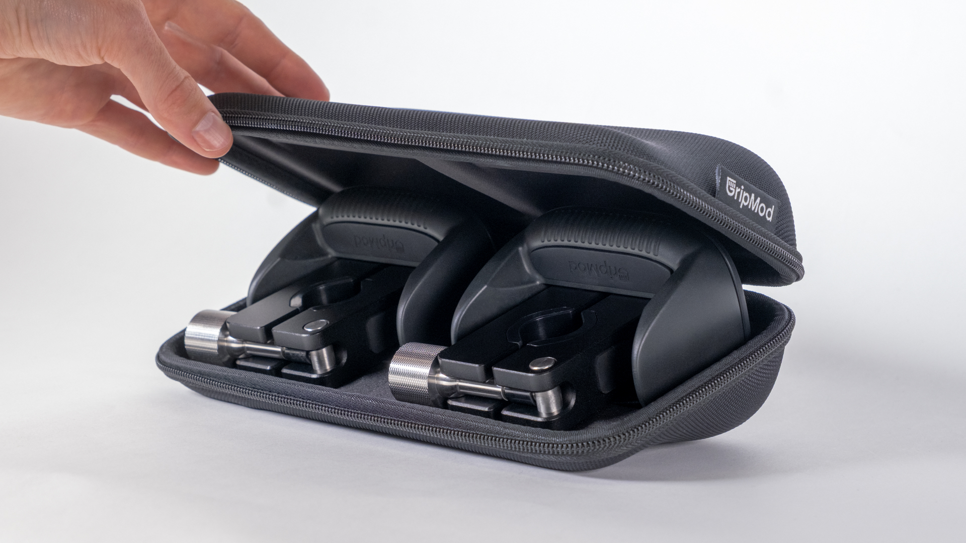 GripMod grip attachments in a black carrying case.