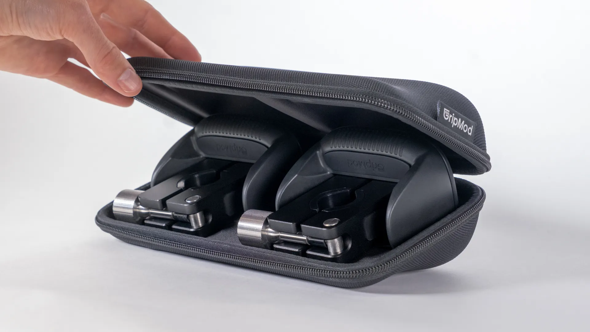 GripMod grip attachments in a black carrying case.
