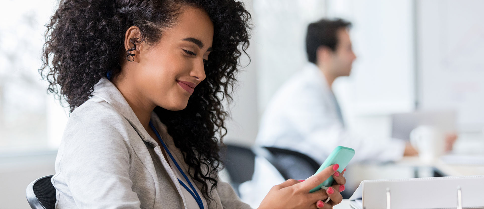 Nurse using phone to message a patient