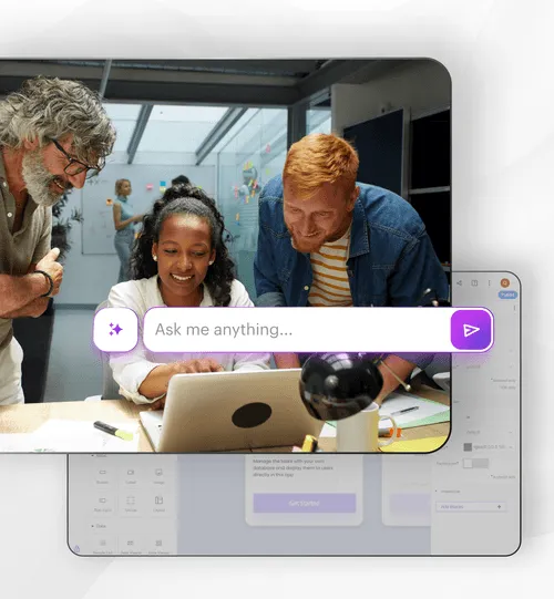 3 people smiling at the office looking at a laptop