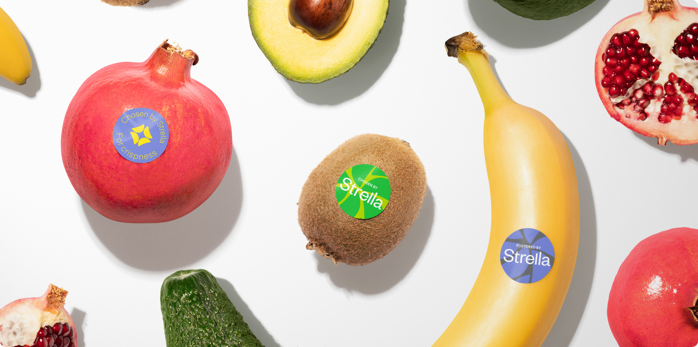 Flatlay of various fruits that have the Strella stickers on them