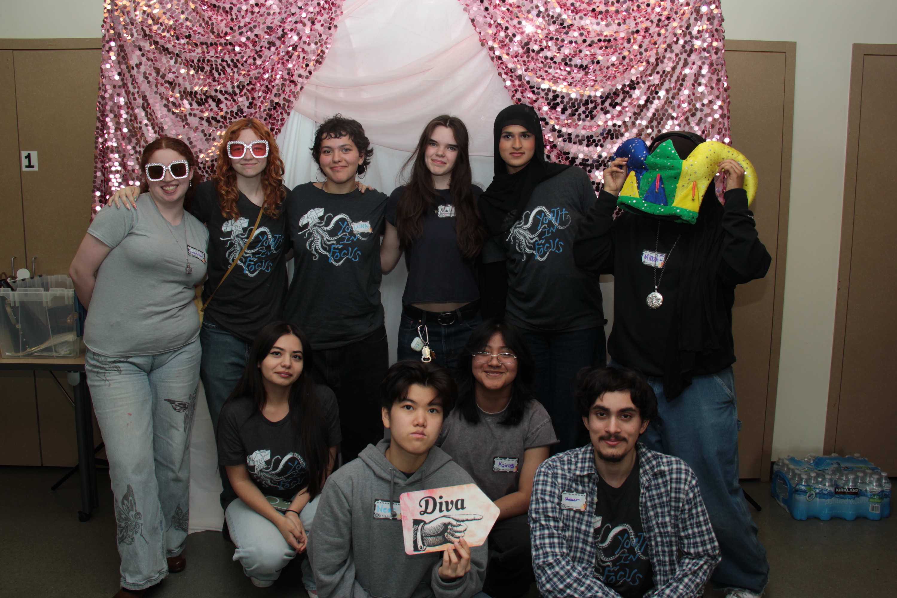 Group of 10 BIPOC students posing in front of a white background